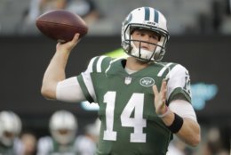 New York Jets quarterback Sam Darnold (14) warms up before an NFL football game against the New York Giants, Friday, Aug. 24, 2018, in East Rutherford, N.J. (AP Photo/Julio Cortez)
