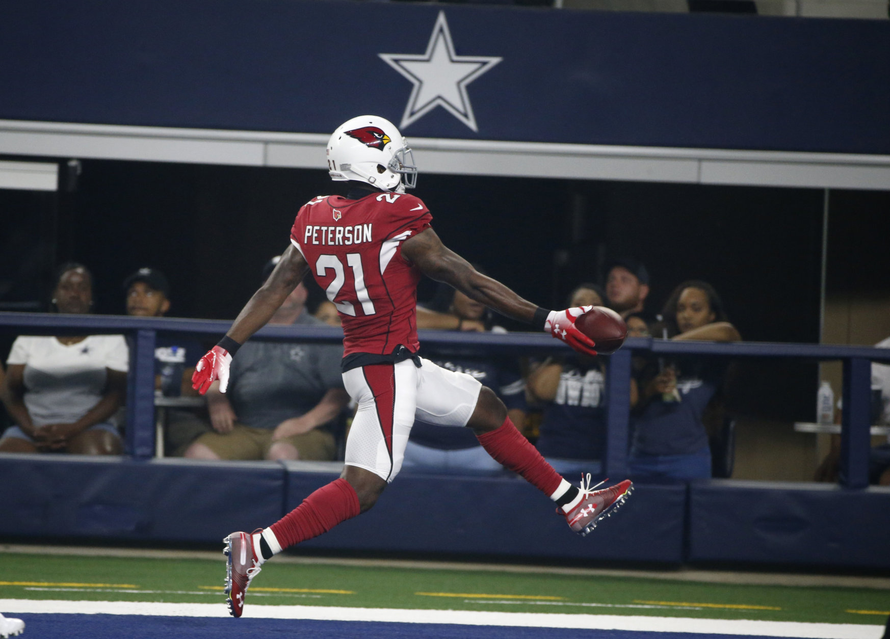 Arizona Cardinals defensive back Patrick Peterson (21) scores a touchdown after making an interception against the Dallas Cowboys during the first half of a preseason NFL football game in Arlington, Texas, Sunday, Aug. 26, 2018. (AP Photo/Michael Ainsworth)