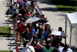 Members of the public line up to pay their respects to Sen. John McCain during a viewing at the Arizona Capitol on Wednesday, Aug. 29, 2018, in Phoenix. (AP Photo/Ross D. Franklin)