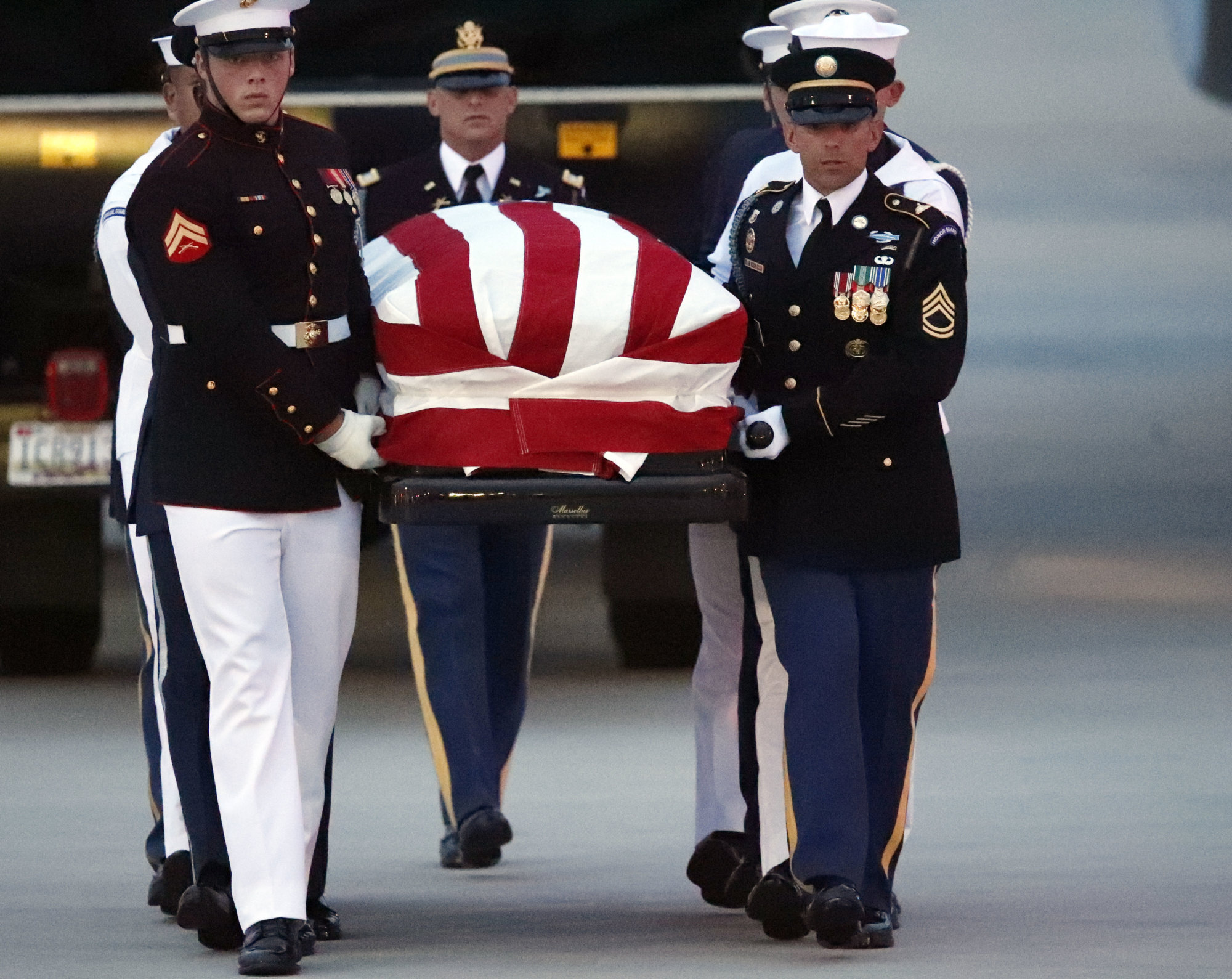 The flag-draped casket of Sen. John McCain, R-Ariz., is carried by an Armed Forces body bearer team to a hearse, Thursday, Aug. 30, 2018, at Andrews Air Force Base, Md. (AP Photo/Alex Brandon)