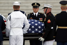 The flag-draped casket of Sen. John McCain, R-Ariz., is carried up the steps to lie in state in the Rotunda of the U.S. Capitol, Friday, Aug. 31, 2018, in Washington. (AP Photo/Alex Brandon)