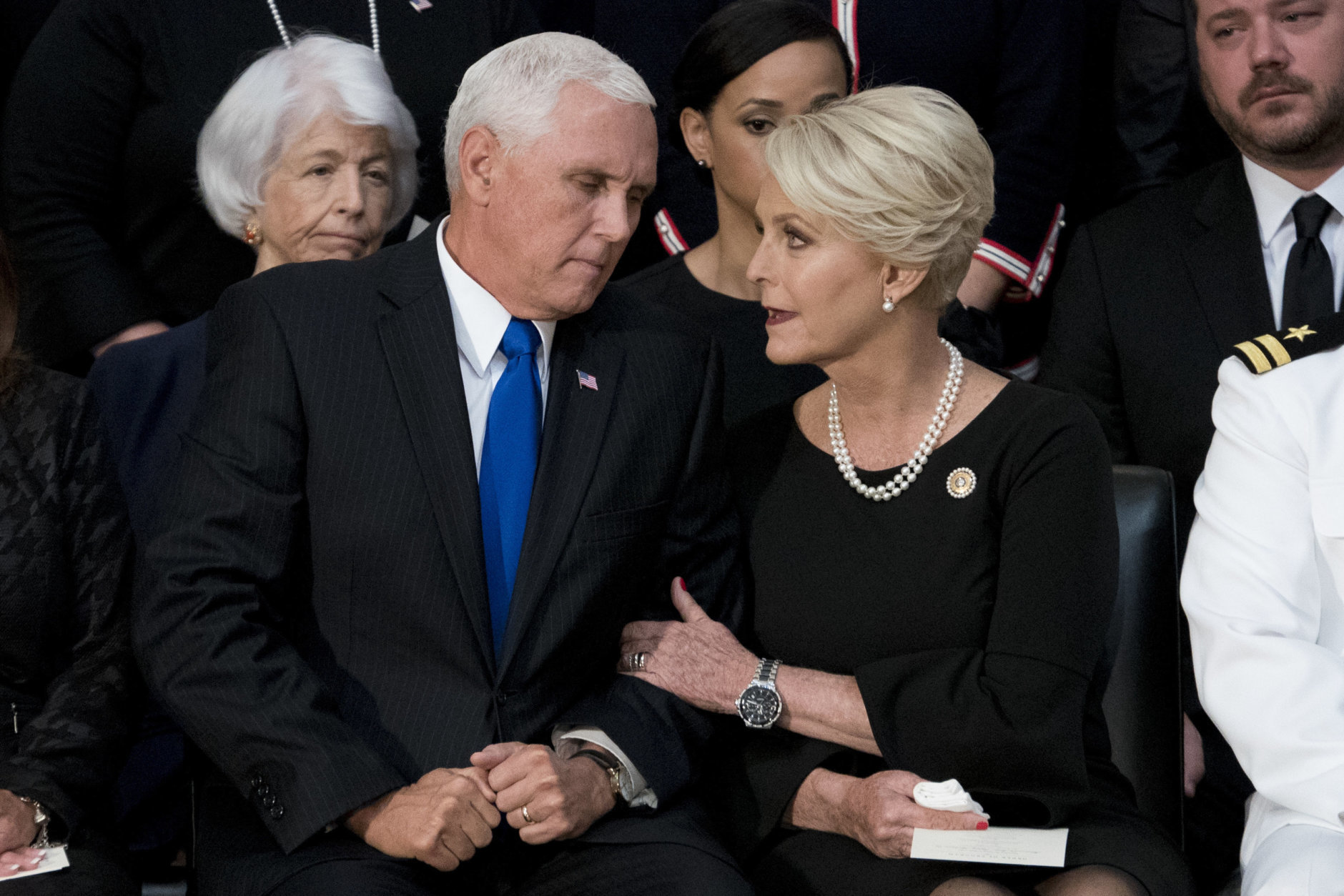 Cindy McCain, wife of Sen. John McCain, R-Ariz., right, talks with Vice President Mike Pence, left, after he speaks at a ceremony for John McCain as he lies in state in the Rotunda of the U.S. Capitol, Friday, Aug. 31, 2018, in Washington. (AP Photo/Andrew Harnik, Pool)