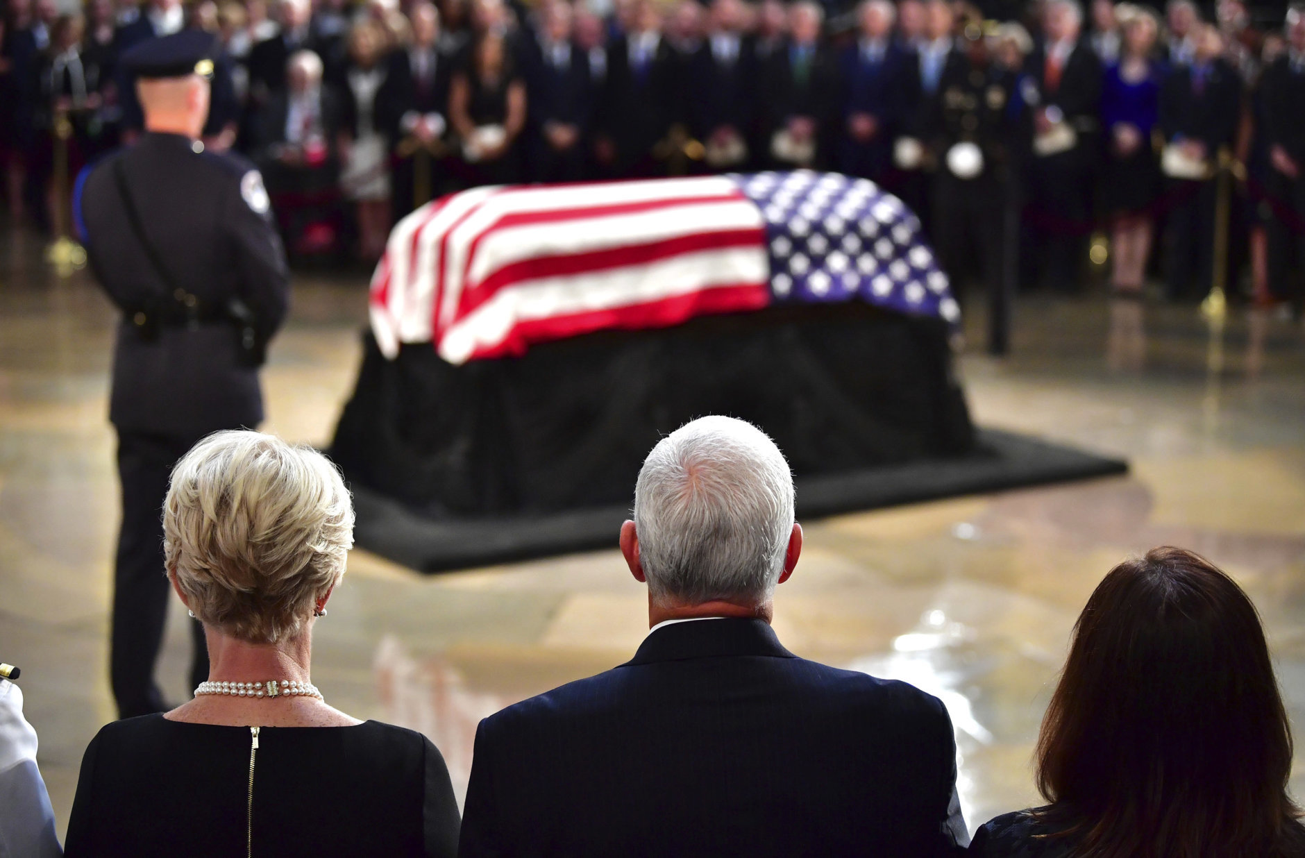 From left, Cindy McCain, Vice President Mike Pence and his wife Karen Pence stand during a ceremony for Sen. John McCain, R-Ariz., as he lies in state in the Rotunda at the U.S. Capitol, in Washington, Friday, Aug. 31, 2018. (Kevin Dietsch/Pool Photo via AP)