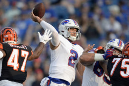 FILE - In this Aug. 26, 2018, file photo, Buffalo Bills quarterback Nathan Peterman (2) throws a pass during the second half of a preseason NFL football game against the Cincinnati Bengals, in Orchard Park, N.Y. The Buffalo Bills have named Nathan Peterman their starting quarterback in a job the second-year player is expected to hold until rookie first-round pick Josh Allen is deemed ready. The Bills made the announcement on their Twitter account before practice Monday morning, Sept. 3, 2018, as the team prepares for its season opener at Baltimore on Sunday. (AP Photo/Adrian Kraus, File)