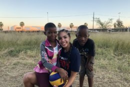 Sophomore libero Abby Morrow poses with some local children on the trip. The team held youth clinics in addition to playing national and local university teams. (Courtesy Howard Athletics)