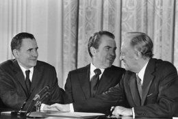 U.S. President Richard Nixon after signing the formal proclamation declaring the United States and Soviet Union have bound themselves by treaty to curb their anti ballistic-missile activities. He announced a souvenir pen would be given to all participants at the ceremony in the White House East Room, Washington on Oct. 3, 1972. At left is Soviet Foreign Minister Andrei Gromyko. Man at right is unidentified. (AP Photo/Henry Burroughs)