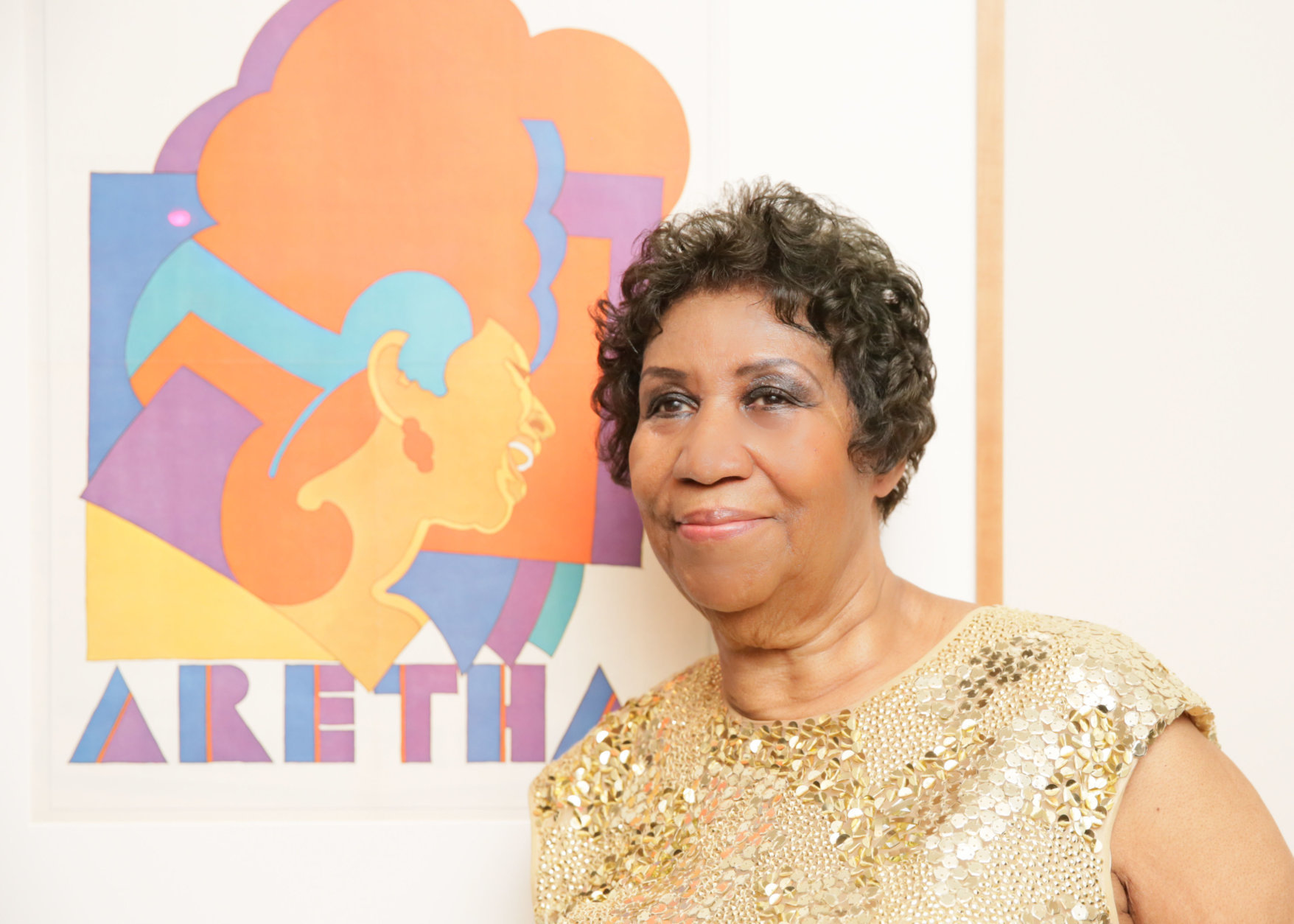 Aretha Franklin  with  her  Portrait at the  American Portrait Gala in 2015. (Courtesy  of  Angela  Pham  BFA)