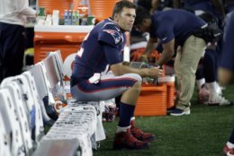 New England Patriots quarterback Tom Brady watches from the sideline during the first half of a preseason NFL football game against the Washington Redskins, Thursday, Aug. 9, 2018, in Foxborough, Mass. (AP Photo/Charles Krupa)