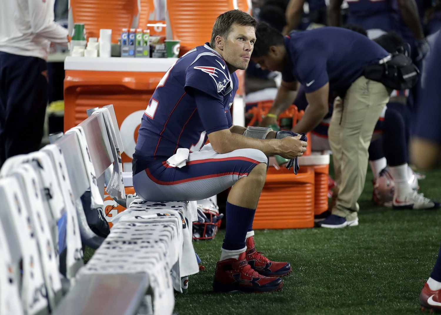 New England Patriots quarterback Tom Brady watches from the sideline during the first half of a preseason NFL football game against the Washington Redskins, Thursday, Aug. 9, 2018, in Foxborough, Mass. (AP Photo/Charles Krupa)