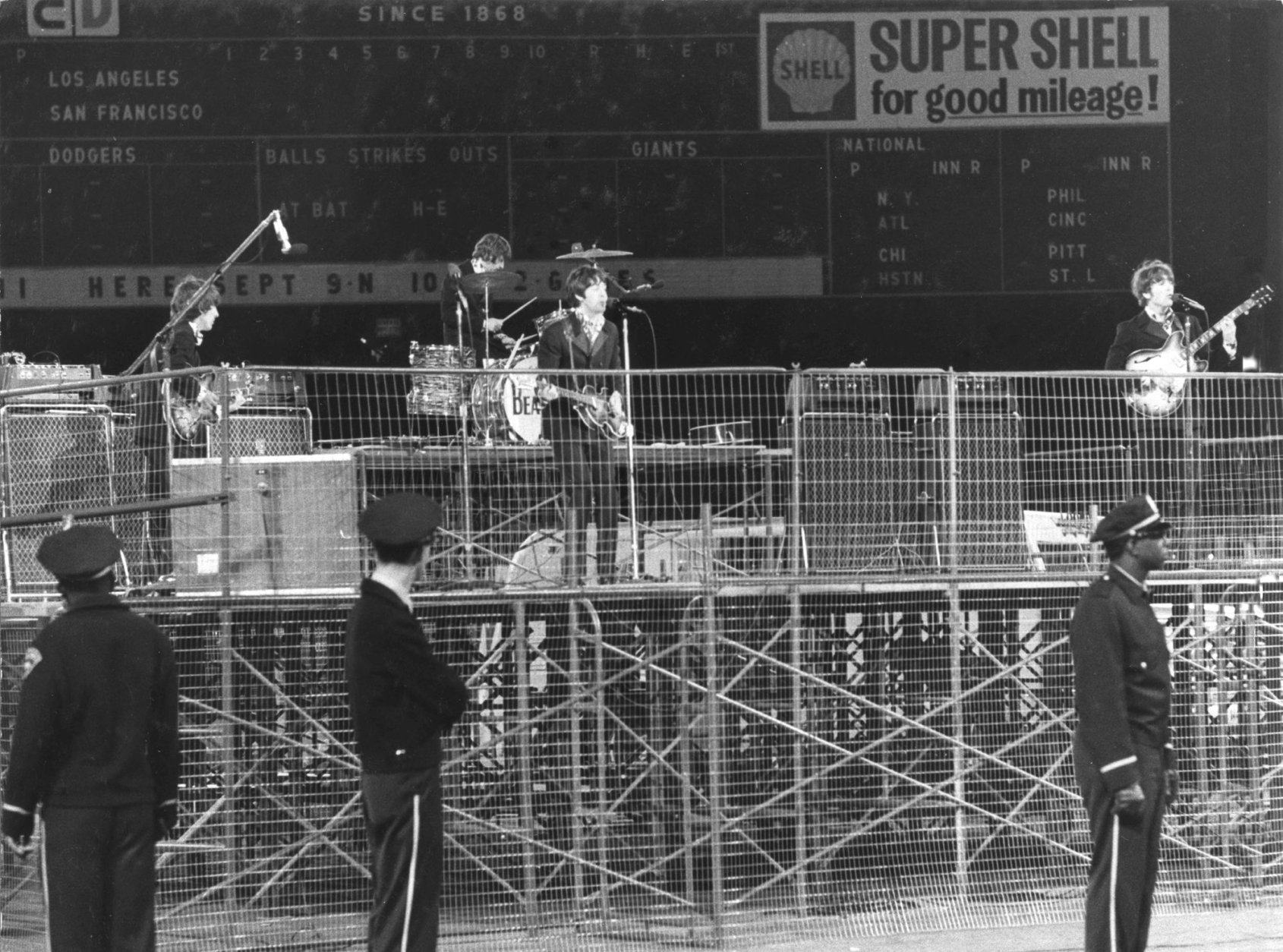 In this photo taken Aug. 29, 1966, the Beatles perform at Candlestick Park in San Francisco. Candlestick Park, known for its bone-numbing winds, the Catch and the earthquake-rocked 1989 World Series is officially closing after more than a half century of hosting sporting and cultural events. In a bow to historical symmetry, the Stick's finale will be a performance Thursday by Paul McCartney, 48 years after the Beatles' last scheduled concert lit up the venue. (AP Photo/Fred Pardini)