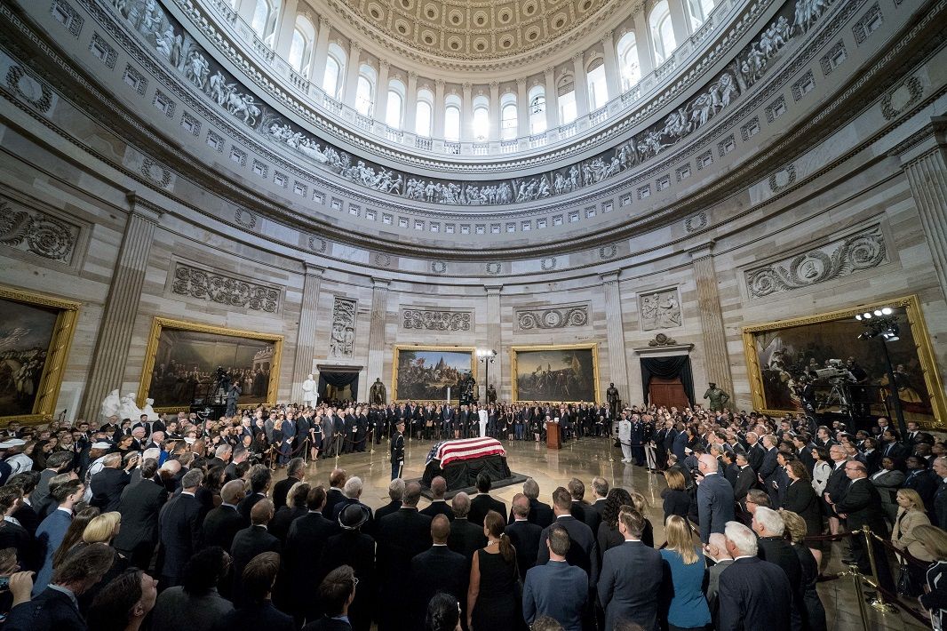 The casket of Sen. John McCain, R-Ariz., lies in state at the U.S. Capitol, Friday, Aug. 31, 2018, in Washington. (AP Photo/Andrew Harnik, Pool)
