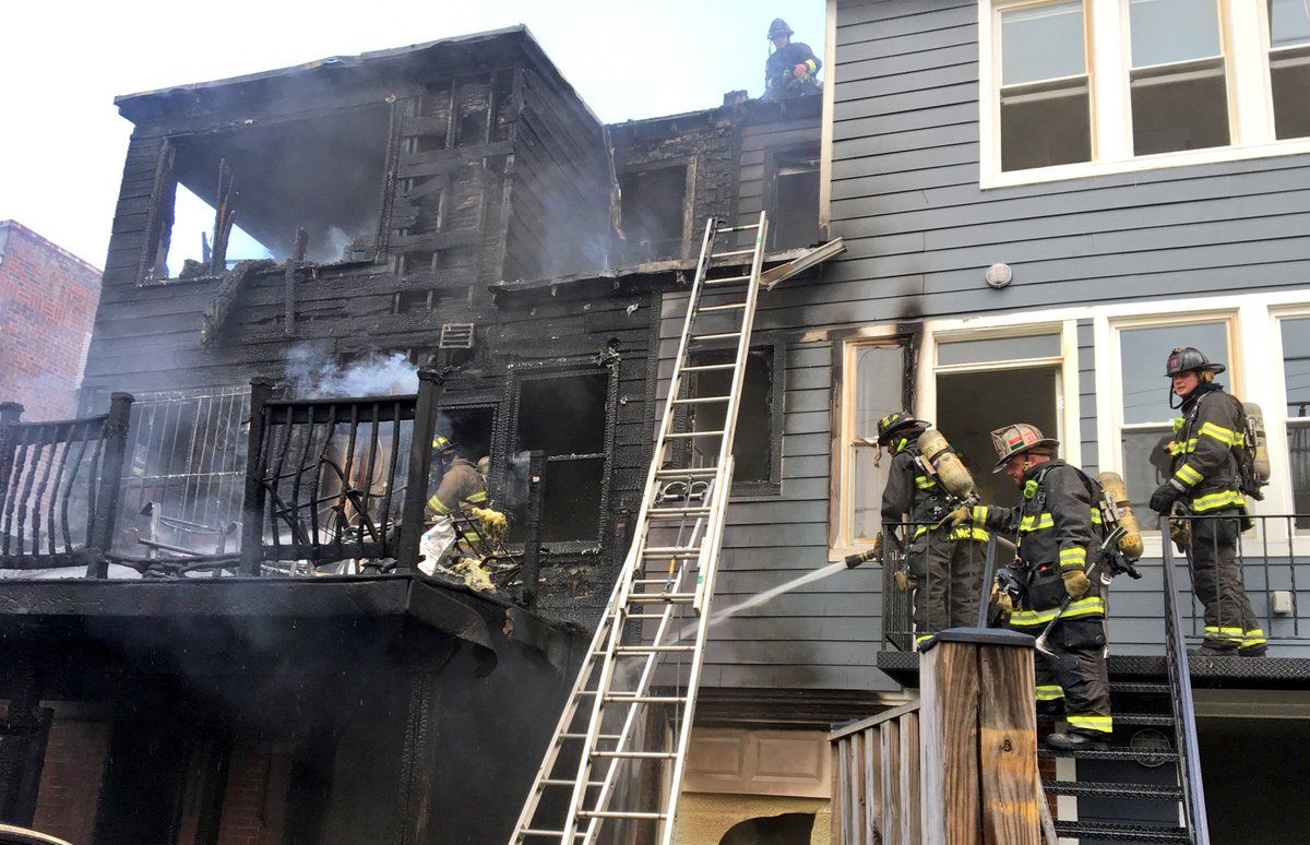 Fire officials said the fire was near the rear porches of the two adjacent town houses when they arrived on the scene. (Courtesy DC Fire and EMS)