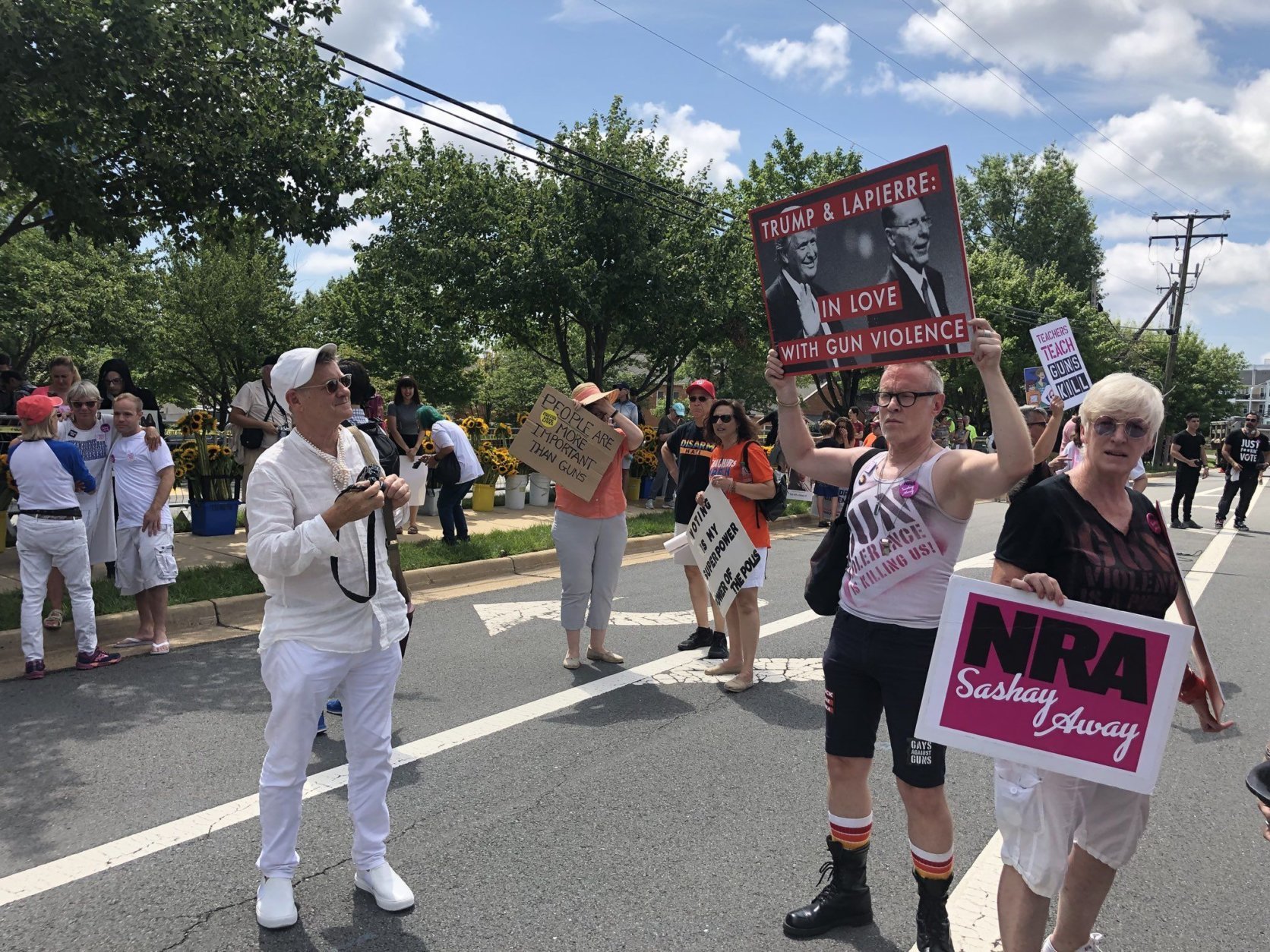 Hundreds rallies in the street outside the NRA headquarters on Saturday afternoon. (WTOP/Melissa Howell)