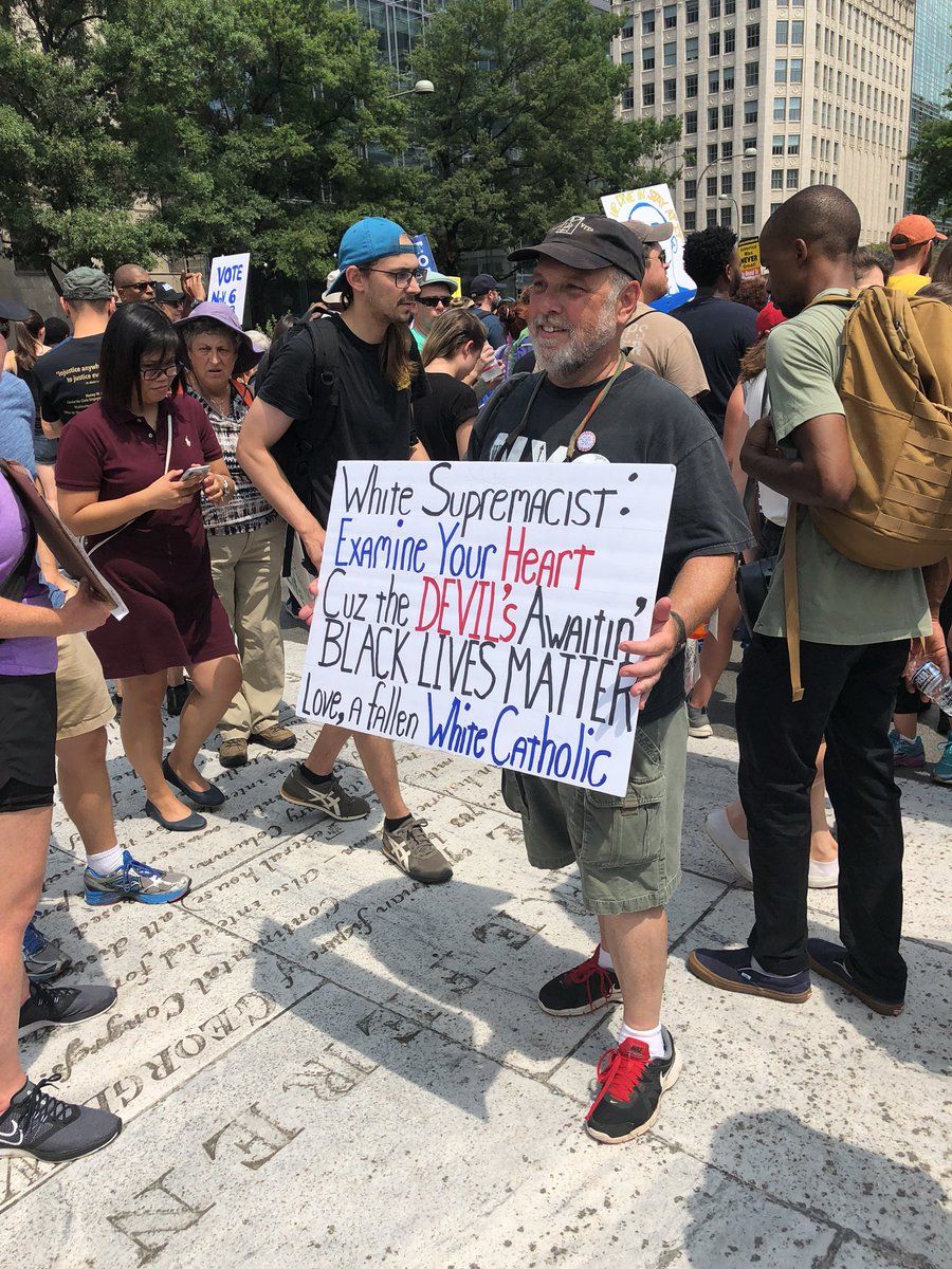 People gather at Freedom Plaza for an anti-hate rally ahead of a march to Lafayette Square on Sunday, Aug. 12. (WTOP/Keara Dowd)