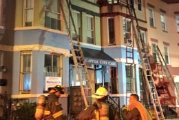 Firefighters were able to confine the fire to the roof decks and rooftop storage structures, preventing the fire from moving downward. (Courtesy DC Fire and EMS) 
