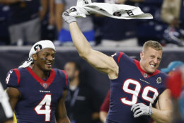 HOUSTON, TX - AUGUST 18:  J.J. Watt #99 of the Houston Texans and Deshaun Watson #4 celebrate the winning touchdown by Vyncint Smith #17 in the fourth quarter against the San Francisco 49ers during a preaseason game at NRG Stadium on August 18, 2018 in Houston, Texas.  (Photo by Bob Levey/Getty Images)