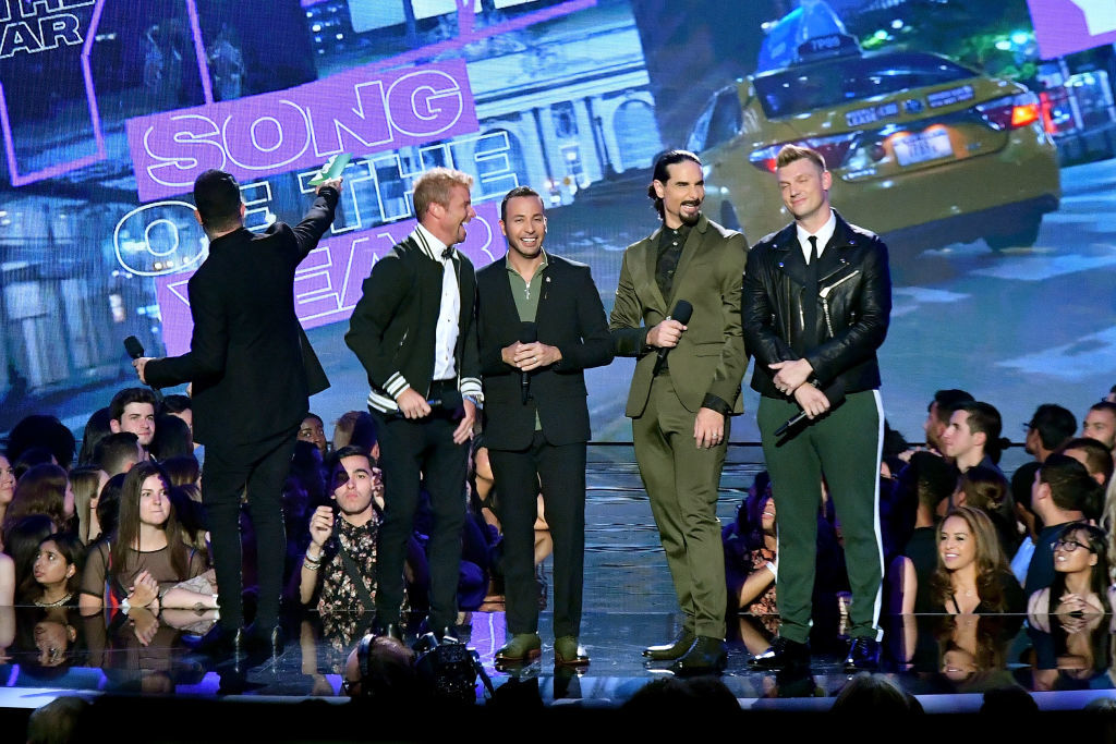 NEW YORK, NY - AUGUST 20:  AJ McLean, Brian Littrell, Howie Dorough, Howie Dorough, and Nick Carter of Backstreet Boys speak onstage during the 2018 MTV Video Music Awards at Radio City Music Hall on August 20, 2018 in New York City.  (Photo by Michael Loccisano/Getty Images for MTV)