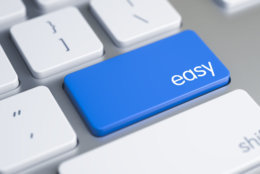 Easy Written on Blue Key of Metallic Keyboard. High Quality Render of a Modern Keyboard Button. The Button is Blue in Color and there is Caption Easy on It. 3D Render.