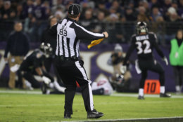 BALTIMORE, MD - NOVEMBER 27: Back Judge Shawn  Hochuli throws a flag in the third quarter between the Baltimore Ravens and the Houston Texans at M&amp;T Bank Stadium on November 27, 2017 in Baltimore, Maryland. (Photo by Rob Carr/Getty Images)