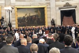 Mike Pence speaks in front of Senator John McCain's casket in the Capitol Rotunda. (WTOP/Chris Cioffi)