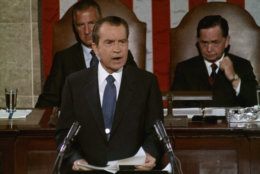 President Richard Nixon addresses a Joint Session of Congress, Sept. 9, 1971, to explain his new economic policy following his sudden freeze on prices, rents and wages of Aug. 15. Seated behind him on the dais are Vice President Spiro Agnew, acting as president of the Senate, and Speaker of the House Carl Albert. (AP Photo)