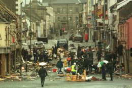 RUC officers look at the debris Sunday, August 16, 1998, following yesterday's bomb in Omagh town centre. The bomb exploded Saturday afternoon killing 28 people and injuring a further 220. (AP Photo/Alastair Grant).