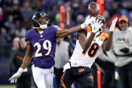 BALTIMORE, MD - DECEMBER 31: Wide Receiver A.J. Green #18 of the Cincinnati Bengals catches a pass while defended by defensive back Marlon Humphrey #29 of the Baltimore Ravens in the first quarter at M&amp;T Bank Stadium on December 31, 2017 in Baltimore, Maryland. (Photo by Rob Carr/Getty Images)