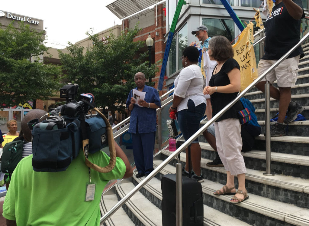 A group of supporters gatheres on Sunday Aug. 5, 2018, in downtown supporters to demand justice and changed after a Montgomery County police officer shot Robert Lawrence White, who was not armed, last June. (WTOP/Liz Anderson)