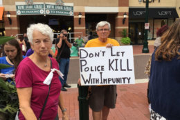 A group of supporters gatheres on Sunday Aug. 5, 2018, in downtown supporters to demand justice and changed after a Montgomery County police officer shot Robert Lawrence White, who was not armed, last June. (WTOP/Liz Anderson)
