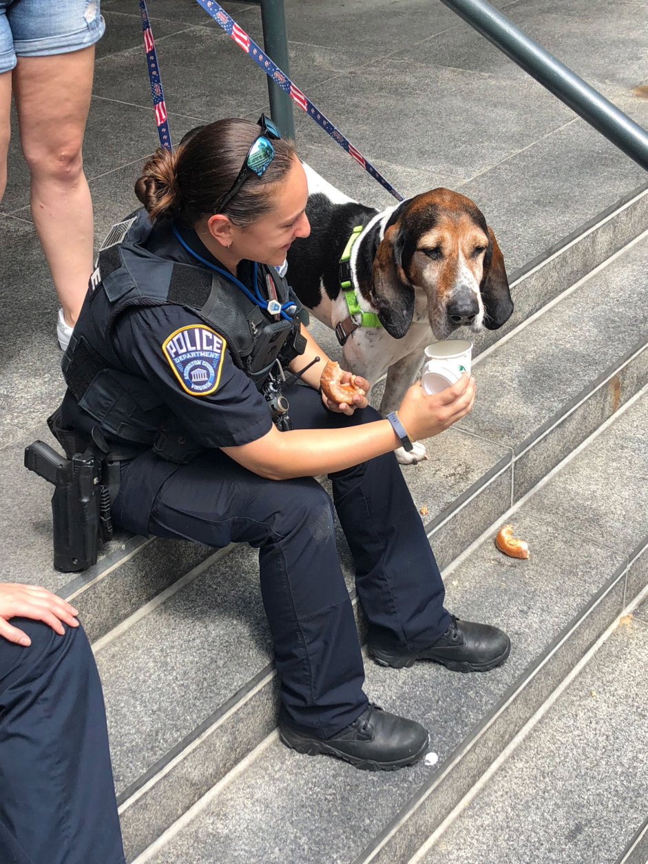 After Nats Park, Smoke went to the Arlington Police Department, where he got a bite of a donut and something to drink. (Courtesy Animal Welfare League of Arlington)