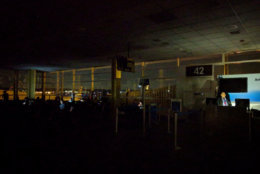 Travelers at Reagan National Airport sit in the dark on Wednesday, Aug. 15, 2018. (Courtesy Samuel Breslow via Twitter <a href="https://twitter.com/sdkb42/status/1029906897447669760">@sdkb42</a>)