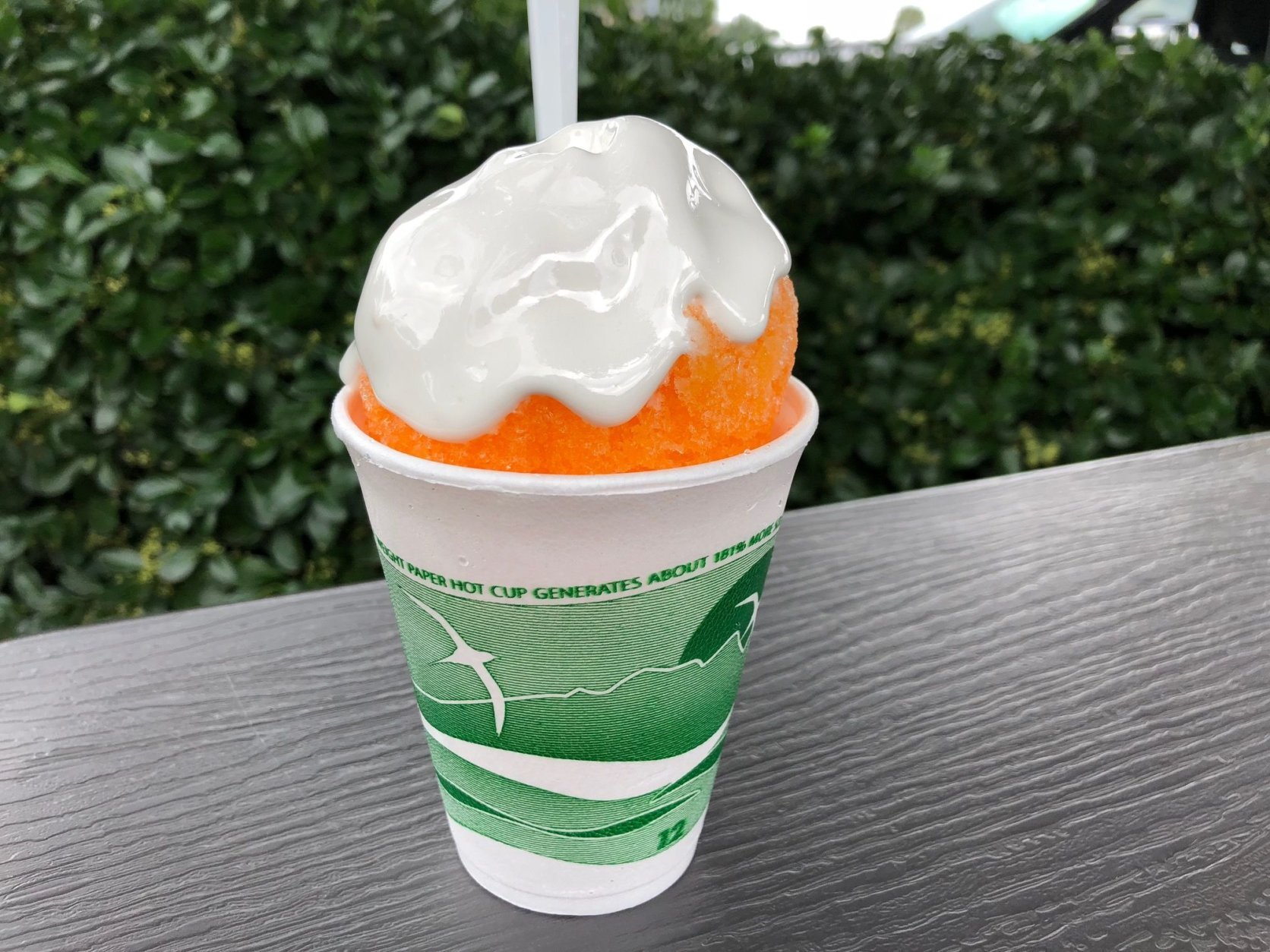 A snowball is a summer dessert made from finely shaved or chipped ice, covered in flavored syrup and topped with a marshmallow cream. (WTOP/Rachel Nania)