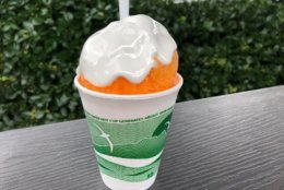 A snowball is a summer dessert made from finely shaved or chipped ice, covered in flavored syrup and topped with a marshmallow cream. (WTOP/Rachel Nania)