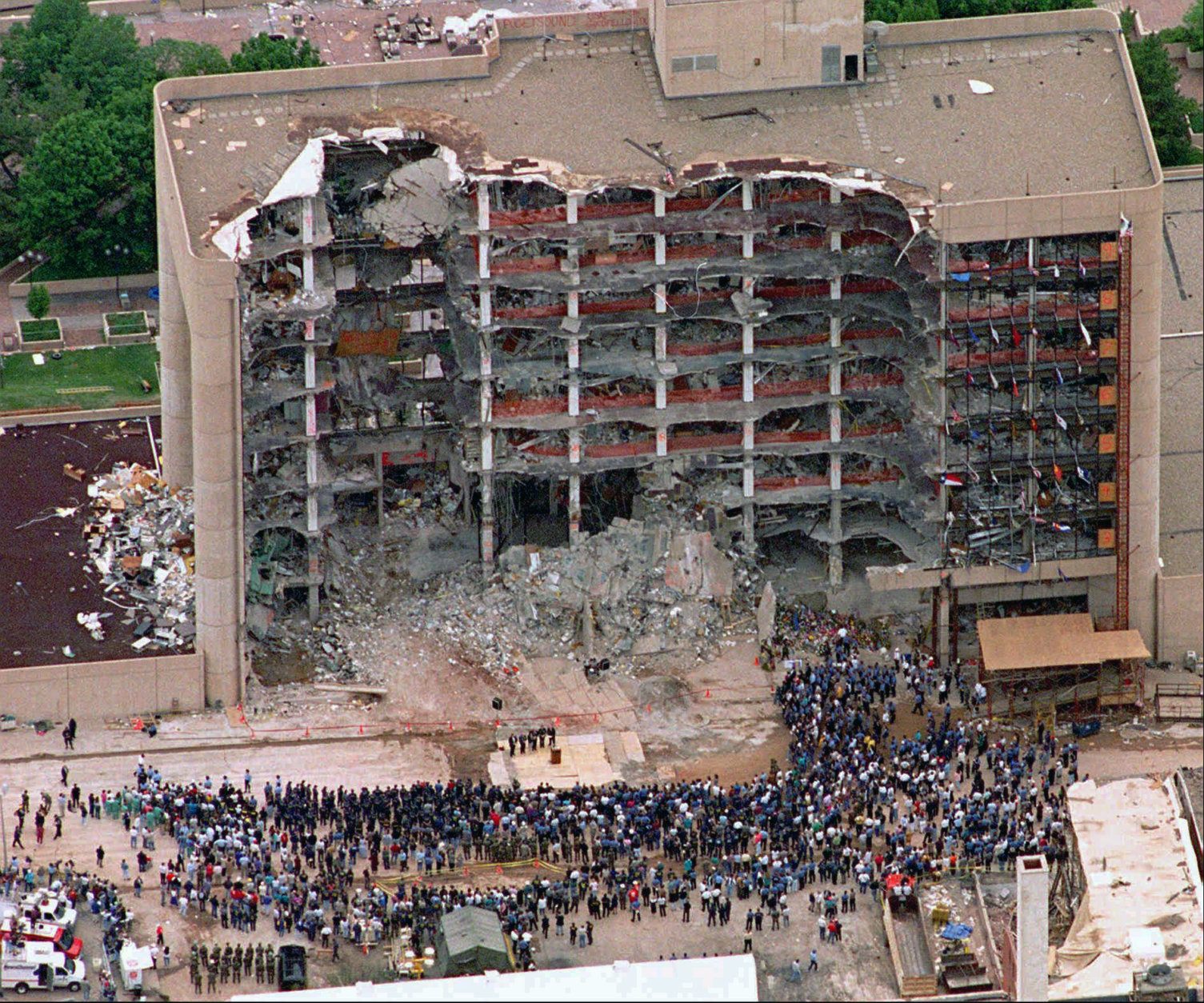 FILE - In this May 5, 1995 file photo, thousands of search and rescue crews attend a memorial service in front of the Alfred P. Murrah Federal Building in Oklahoma City.  More than 600 people were injured in the April 19, 1995 attack and 168 people were killed. Timothy McVeigh was executed in 2001 and Terry Nichols is serving multiple life sentences on federal and state convictions for their convictions in the bombing. (AP Photo/Bill Waugh, FIle)