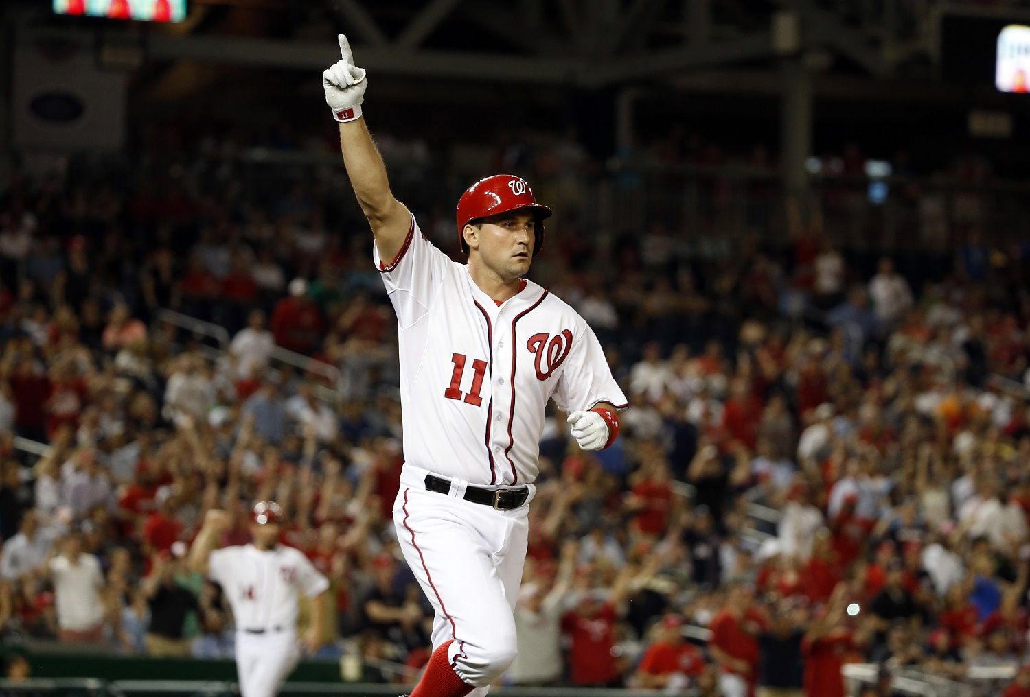 Washington Nationals' Ryan Zimmerman (11) celebrates as he runs the bases for his two-run walk-off home run during the 10th inning of an interleague baseball game against the New York Yankees at Nationals Park, Tuesday, May 19, 2015, in Washington. The Nationals won 8-6 in 10 innings. (AP Photo/Alex Brandon)