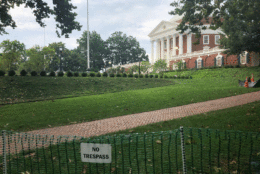 A “no trespass” sign warns visitors near the amphitheater for Saturday morning's "The Hope that Summons Us" event at the University of Virginia. It comes one year after white supremacists marched through the Grounds with tiki torches, and a day before anniversary of Heather Heyer’s death. (WTOP/Max Smith)