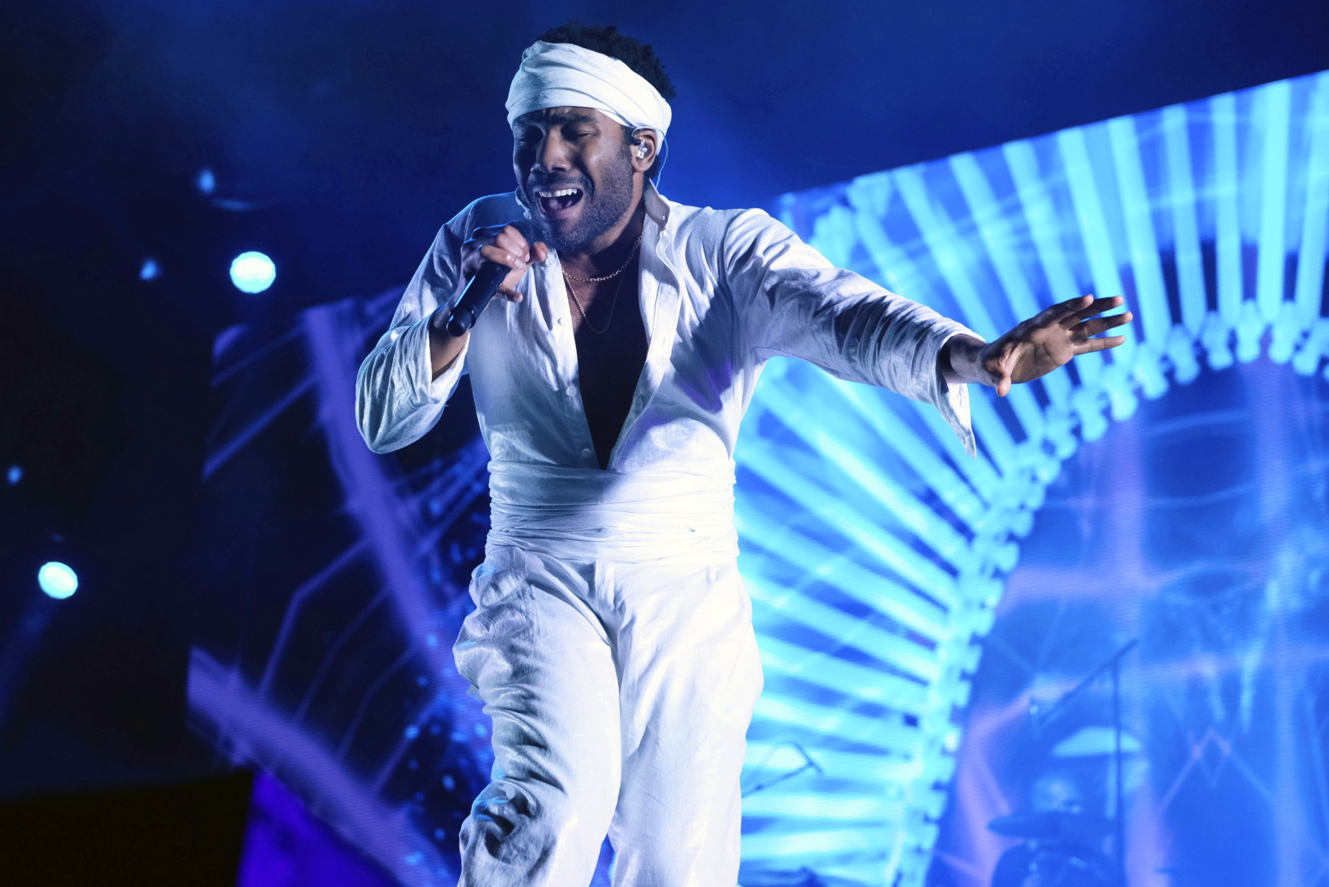 FILE - In this June 3, 2017, file photo, Donald Glover, who goes by the stage name Childish Gambino, performs at the Governors Ball Music Festival in New York. Glover's "Redbone" was named as one of the top songs of the year by the Associated Press. (Photo by Charles Sykes/Invision/AP, File)