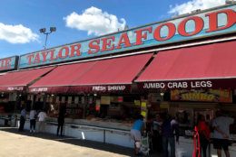 At the fish market in Southwest D.C., people line up for the regional staple at Jessie Taylor Seafood. (WTOP/Mike Murillo)