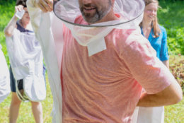 WTOP's Dan Friedell donned a beekeeper's veil and jacket on a visit to the hives deep in the property at Mount Vernon in Virginia. (Courtesy Accor Hotels)