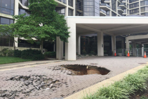 Repairs set to start on large holes in front of Rosslyn condo complex