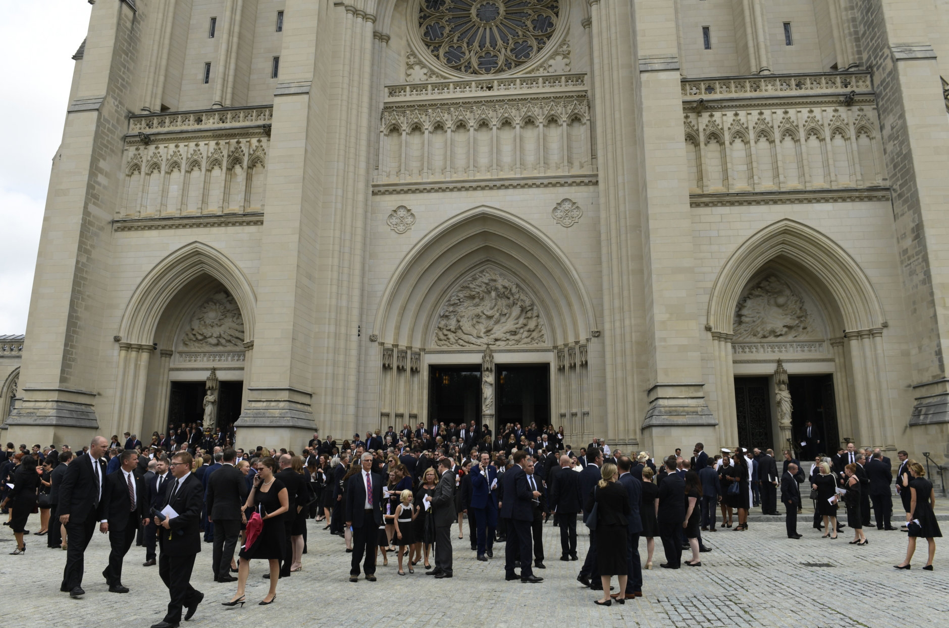 People leave the Washington National Cathedral in Washington, Saturday, Sept. 1, 2018, following a memorial service for Sen. John McCain, R-Ariz. McCain died Aug. 25 from brain cancer at age 81. (AP Photo/Susan Walsh)