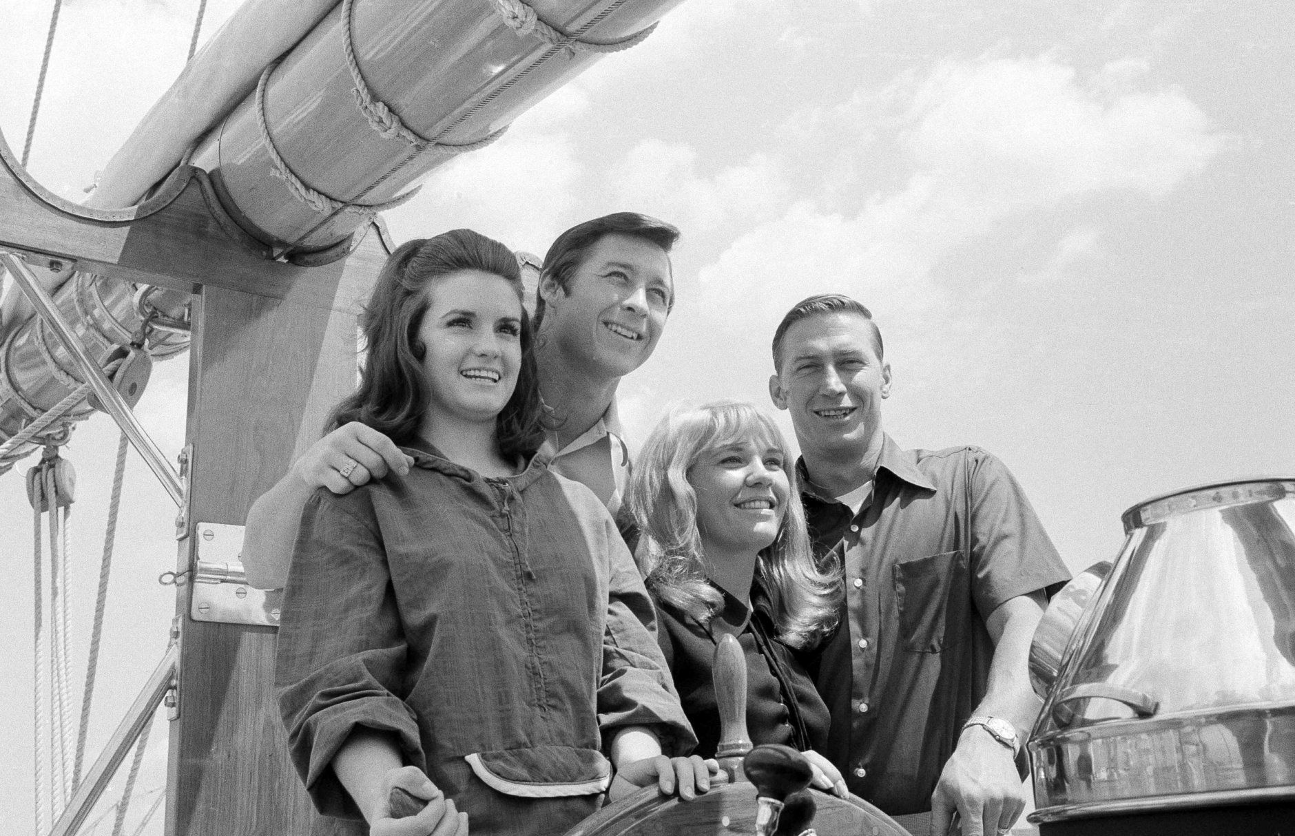 New York Yankees' Bobby Murcer and Mel Stottlemyre, right, pose with their wives Jean Stottlemyre and Kay Murcer  at the wheel of the schooner America during cruise on Long Island Sound, July 6, 1970. The vessel is a replica of the original America, which captured the first Americas Cup in 1851. (AP Photo/Harry Harris)