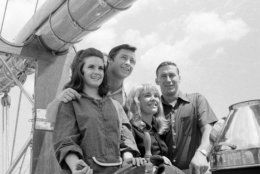 New York Yankees' Bobby Murcer and Mel Stottlemyre, right, pose with their wives Jean Stottlemyre and Kay Murcer  at the wheel of the schooner America during cruise on Long Island Sound, July 6, 1970. The vessel is a replica of the original America, which captured the first Americas Cup in 1851. (AP Photo/Harry Harris)