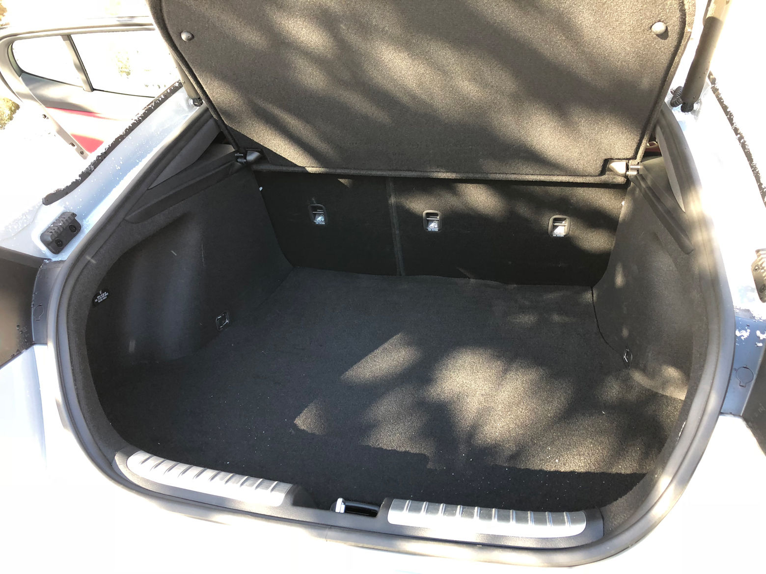 Larger items can fit in the Stinger that might not fit in a normal sedan.