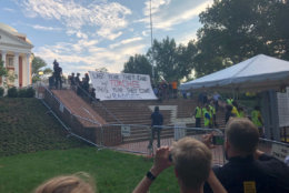 One of the issues the student-led protest addresses is the increased police presence on the campus of the University of Virginia in Charlottesville, one-year after white nationalists marched on campus in a torch-lit rally and surrounded protesters. (WTOP/Max Smith)