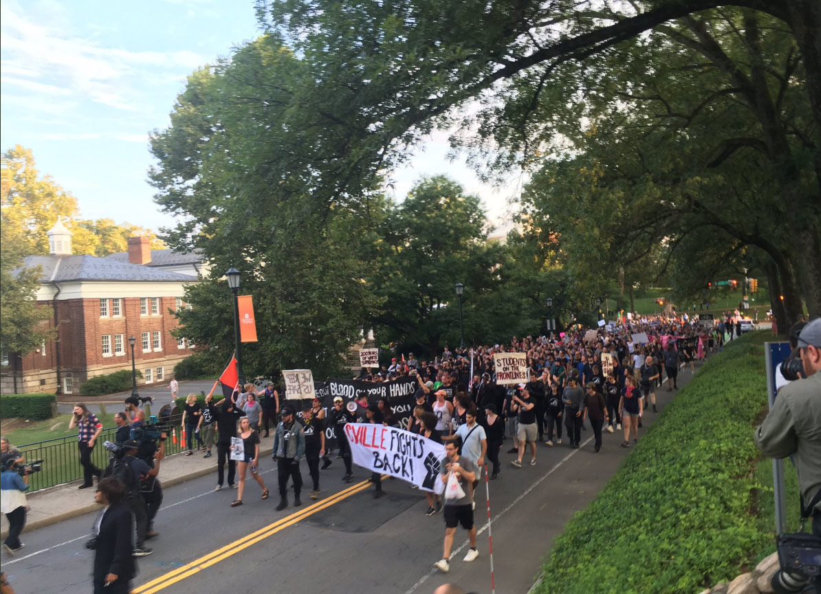 Part of the student-led protest at the University if Virginia in Charlottesville veers from the permit area on Saturday, Aug. 11, 2018. (WTOP/Max Smith)