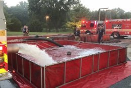 Firefighters are using pools of water to fight the blaze. (Courtesy Daniel Ogren/Montgomery County Fire)  