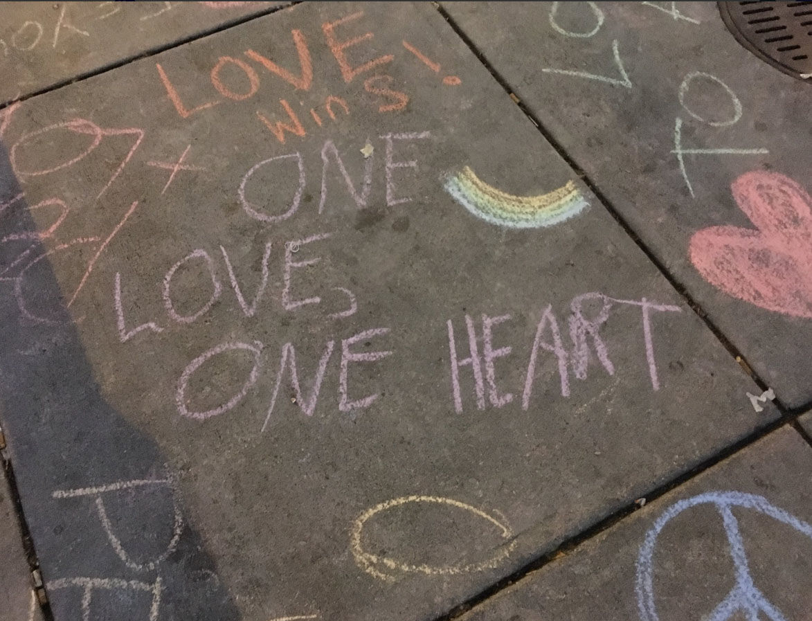 A service at Western Presbyterian Church in Northwest D.C. ends with a walk to the Foggy Bottom Metro station to write messages for rally-goers to read. (WTOP/Liz Anderson)