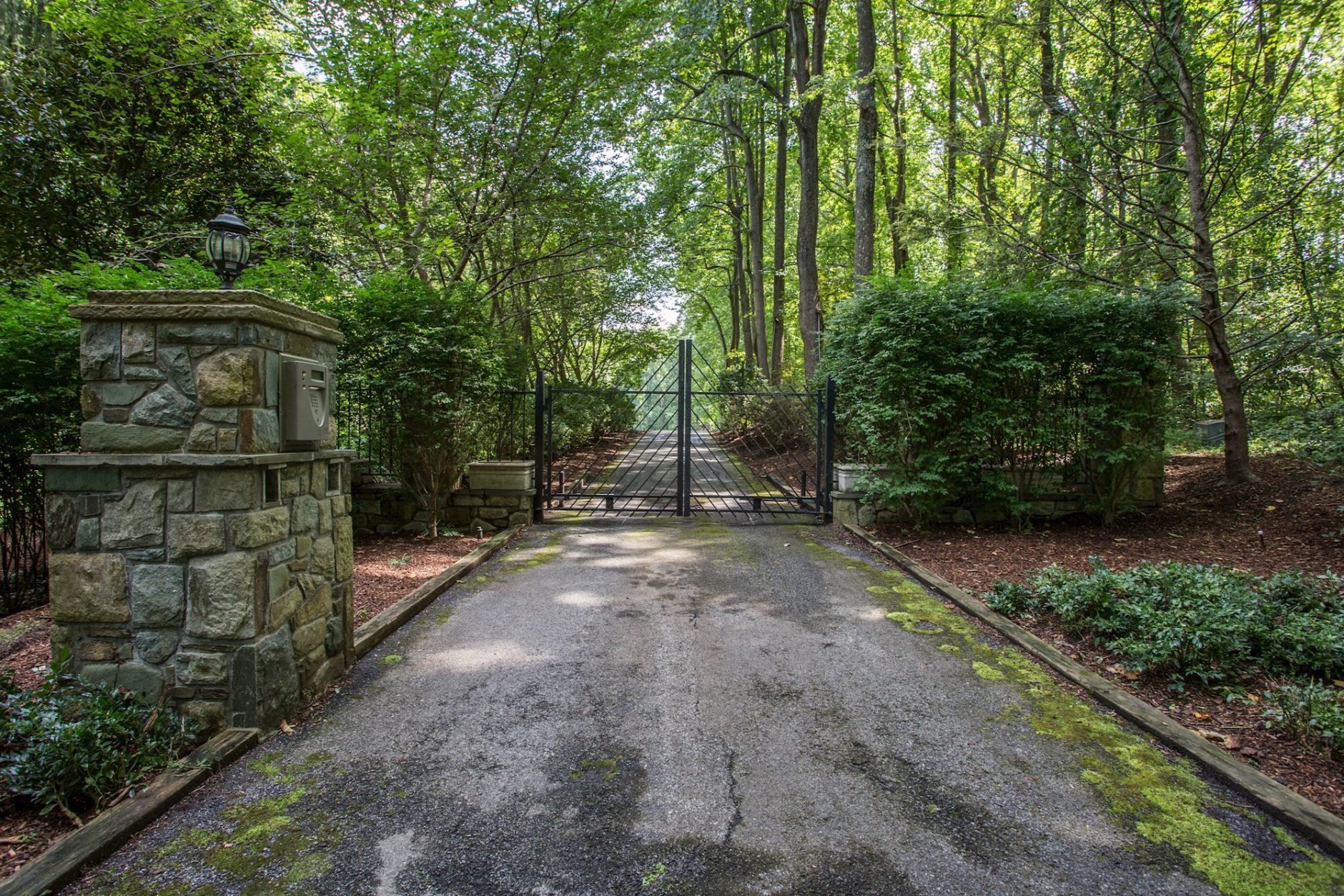 The front security gate at Tom Clancy's Peregrine Cliff estate. (Courtesy Cummings & Co. Realtors)