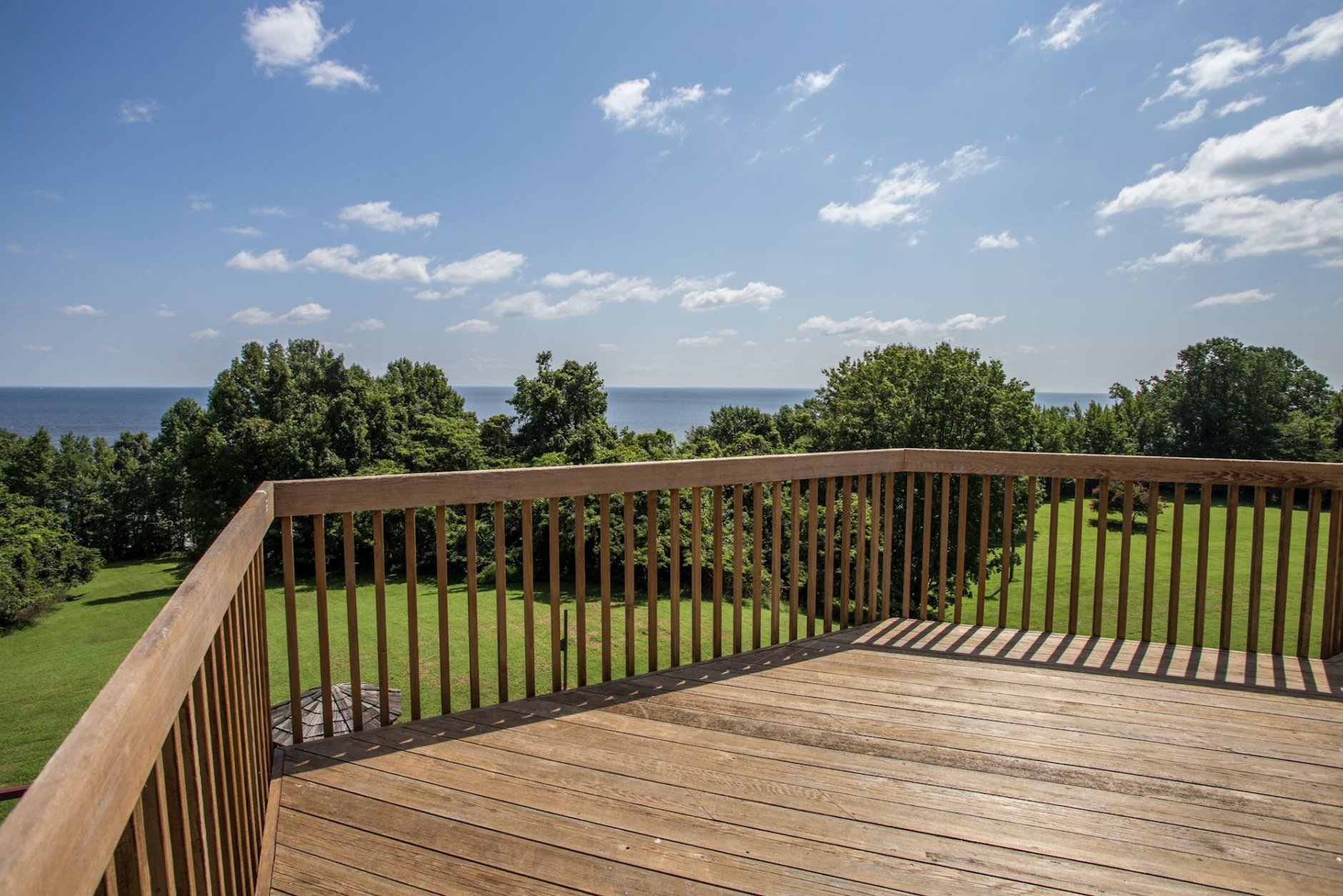 A view of the woods and the Chesapeake Bay from one of the decks at Tom Clancy's estate. (Courtesy Cummings & Co. Realtors)